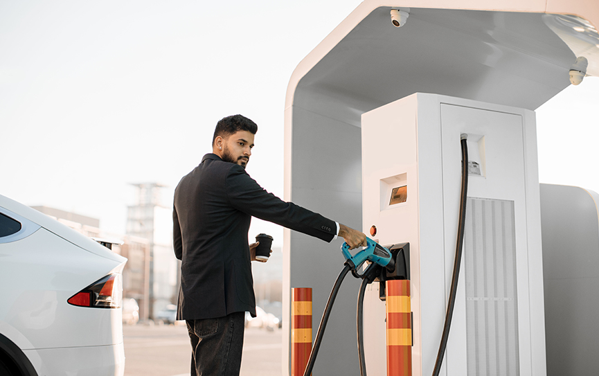 indian-businessman-charging-car-at-outdoor-ev-stat-2023-03-17-23-18-50-utc.jpg