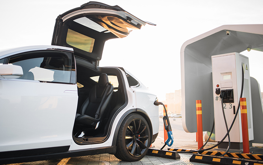 modern-electric-car-charging-at-outdoors-ev-statio-2023-03-17-23-18-45-utc.jpg
